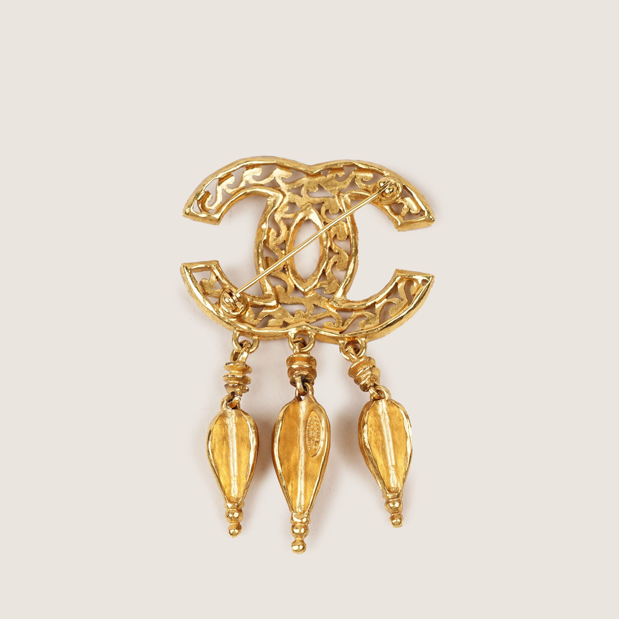 Filigree Logo Gold Tone Brooch
